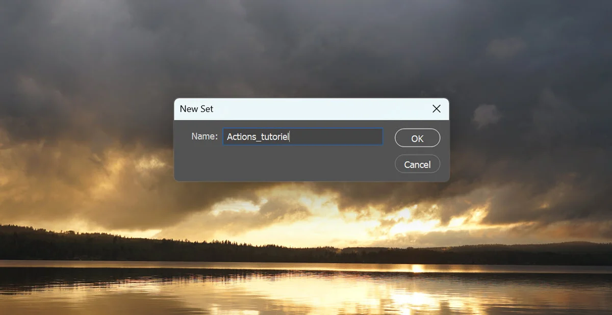 Sur arrière plan d’une image représentant un lac et une montagne à l’horizon pendant un couché de soleil: fenêtre de saisie du nom d’un new Set dans Photoshop